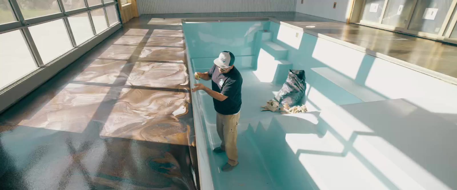 Finished glossy epoxy floor in a sunlit room by JP's Legacy Painting, Wenatchee WA